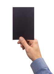 Mockup A6 empty blank black postcard vertically holds the man in his hand in shirt. Isolated on a white background