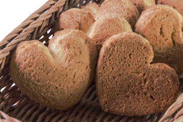 full wicker basket of baked golden sweet cookies hearts