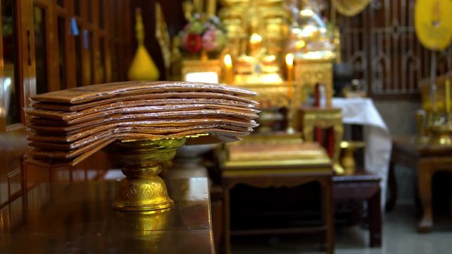 Many set of monk robes placed on the golden tray