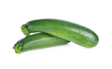 whole fresh zucchini on white background