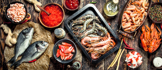 Different seafood with shrimps and red caviar.