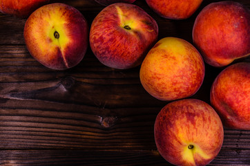 Fresh ripe peaches on wooden table. Top view