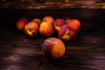 Fresh ripe peaches on wooden table