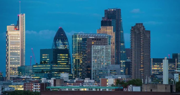 London,England,UK – July 2015 : Timelapse of central London skyline at night with view of The Gherkin, The Leadenhall, Regus and Willis Towers Watson buildings