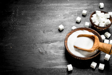 Sugar in a bowl with a scoop.