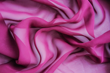 The purple texture of the pleated fabric. Pink georgette fabrics.