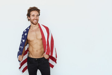 Handsome man posing with flag