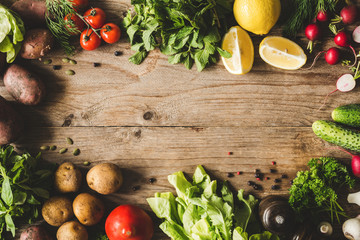 Frame of Fresh Organic Vegetables on wooden background. Top view and copy space for text