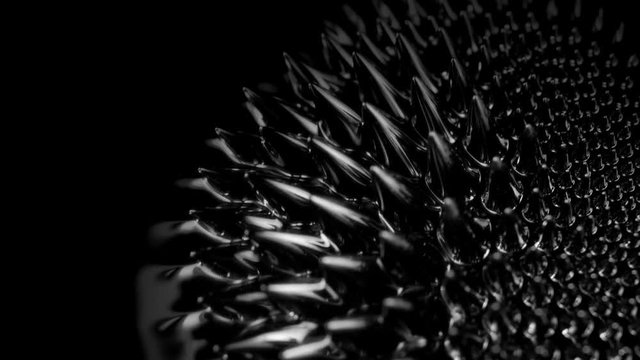 Ferrofluid. Black liquid surface. Abstract background. 