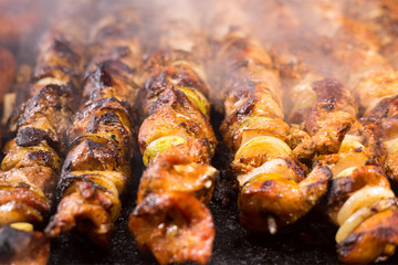 Fresh meat shish kebab prepared on a grill.