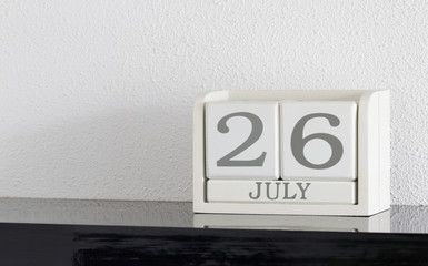 White block calendar present date 26 and month July