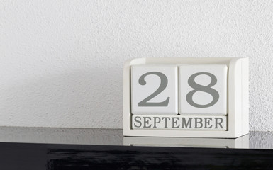 White block calendar present date 28 and month September