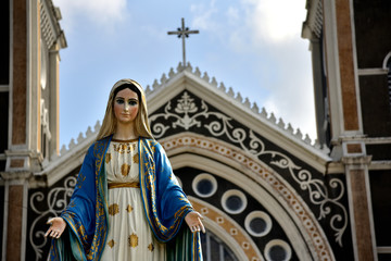 Our Lady is located in front of the small church in the countryside of Thailand.