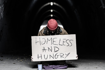 Homeless and hungry person begging