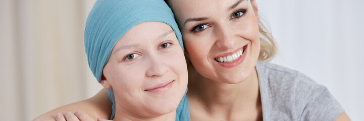 Optimistic cancer girl wearing scarf