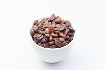 roasted coffee beans on white background space modern style.