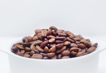 roasted coffee beans on white background space modern style.