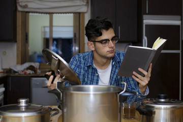 learning to cook with cookbook and pots