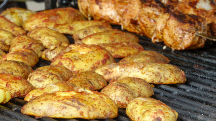 Grilled potatoes and meat