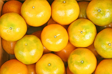Top view mandarin oranges on background,New harvest and fresh from fruit farm