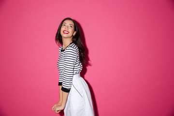 Portrait of a smiling woman posing while standing