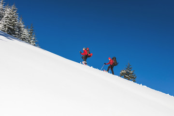 Two climbers are in the mountains.