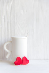 Valentine's Day with white cup coffee red heart on the cup, wood white background, copy space  Valentine Concept.