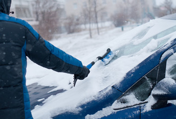 Winter in the city, snowstorm and drifts on the roads. transport service concept.