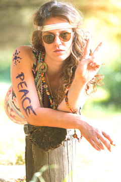 Pretty free hippie girl. Peace. Body painting - Vintage photo effect