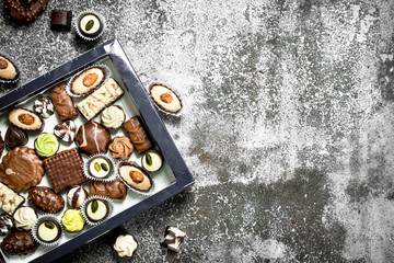 Chocolate sweets in box.