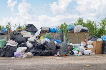 Big rubbish dump near the road. Disposal, deterioration and pollution concept