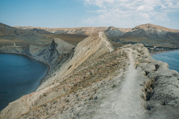 Scenic calm seashore with Crimean mountains ridge, Ukraine, May 2013