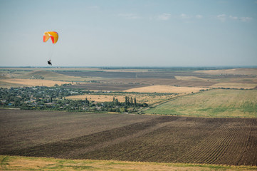 Parachute in the sky over field in hillside area of Crimea, Ukraine, May 2013