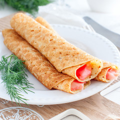 Homemade pancakes with red fish, square