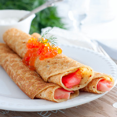 Homemade pancakes with red fish, square