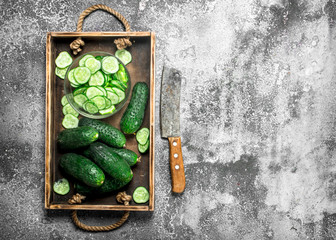 Fresh cucumbers in an old tray.