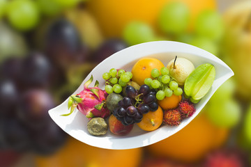 Tropical fruit on a white plate
