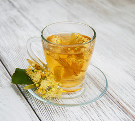 cup of herbal tea with linden flowers