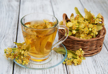 cup of herbal tea with linden flowers