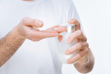 Antibacterial effect. Close up of antibacterial soap being used by a nice pleasant man while washing his hands