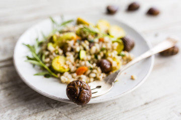 Chestnut salad with pearl barley and vegetables. 