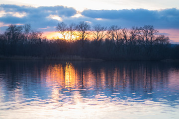 Sunset over the river on a winter evening