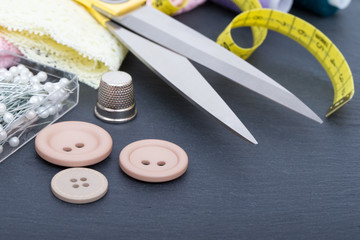 Sewing accessories on black table