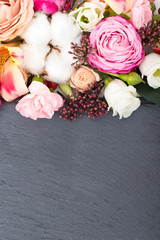 Flowers frame on wooden background