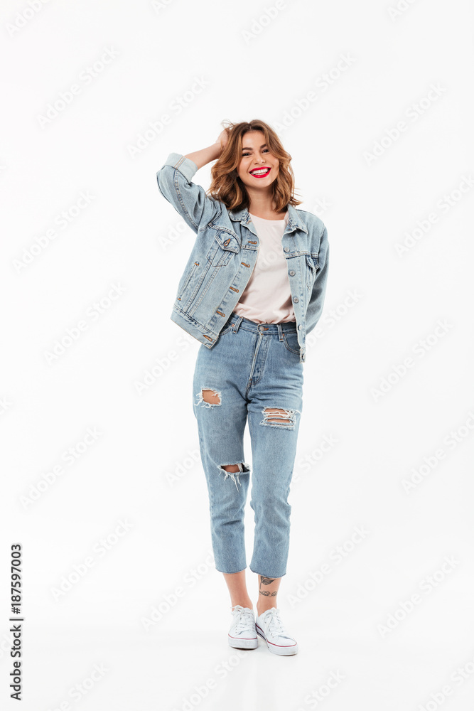 Poster full length image of cheerful woman in denim clothes