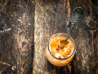 Marinated cabbage in glass jar.