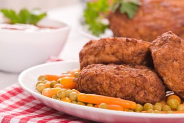 Meatballs on white dish. 
