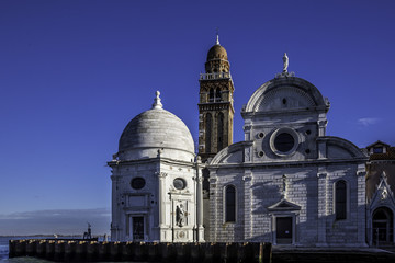 View from the Venice lagoon of the church of San Michele in Isola on the cemetery island of San Michele, Venice, Italy