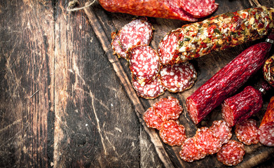 Different kinds of salami on the boards.
