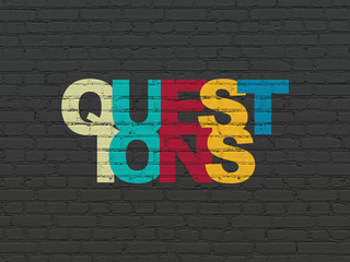 Education concept: Painted multicolor text Questions? on Black Brick wall background